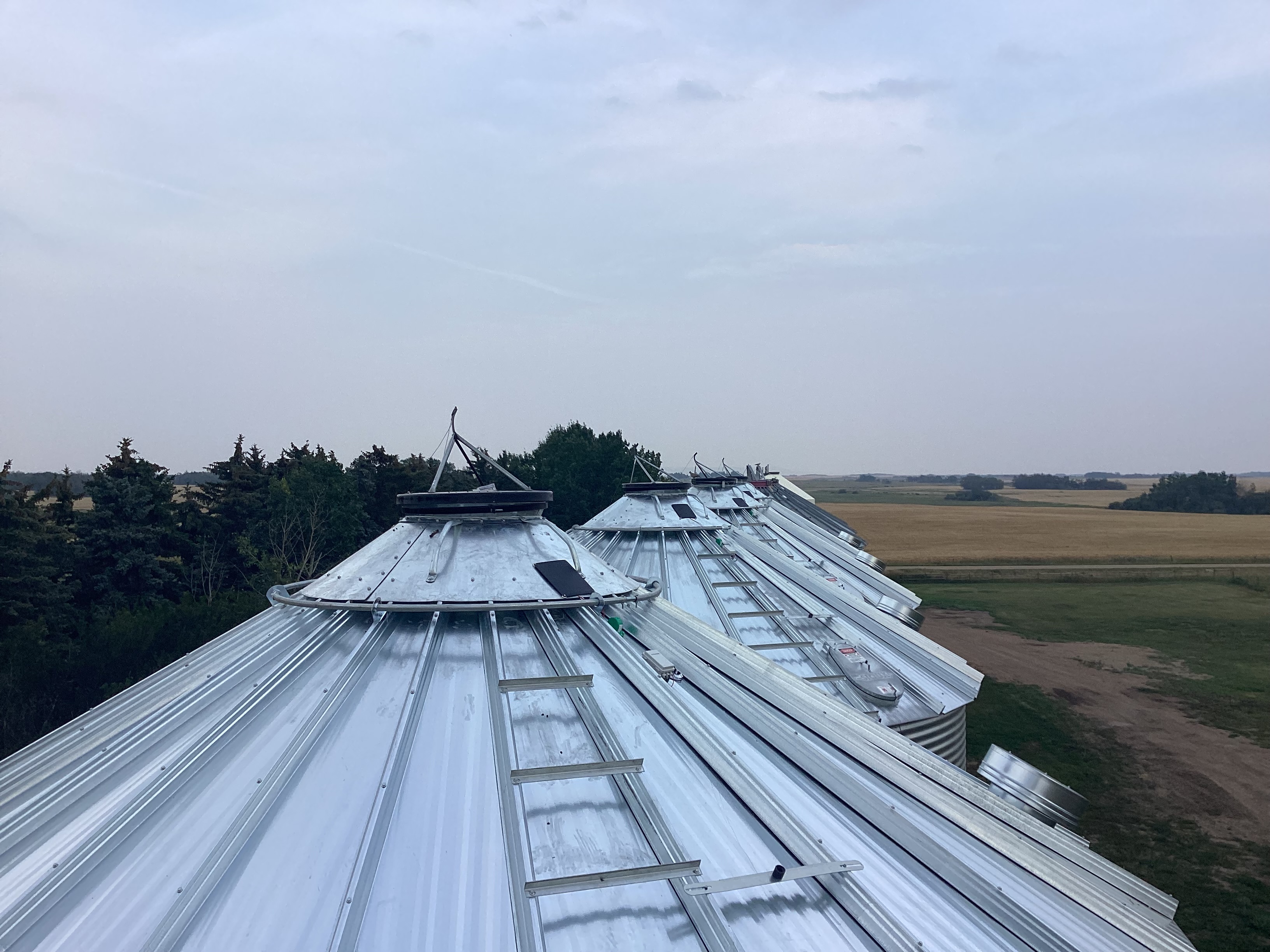 Multiple grain bins with monitoring equipment